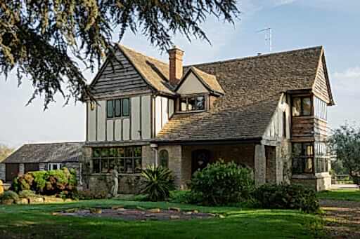 Tudor Style home with triple glazed black aluminium windows