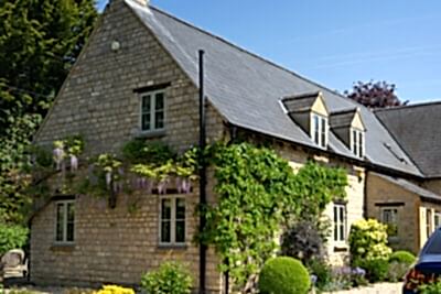 Cotswold Stone home with Glazing Bars on RAL 7032 Pebble Grey STM Tinium windows